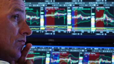 Stocks end mixed, trade choppy after rate cuts