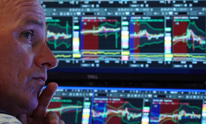 Stocks end mixed, trade choppy after rate cuts