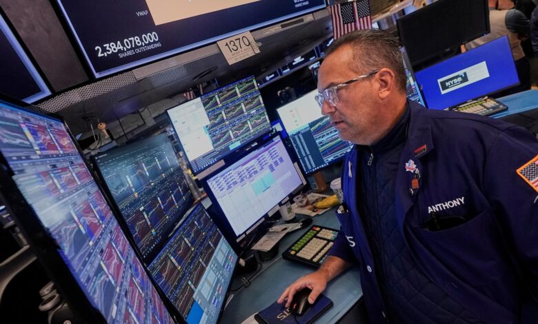 Wall Street edges back from its record heights