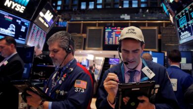 US stocks end higher, Treasury yields rise on easing credit, trade worries