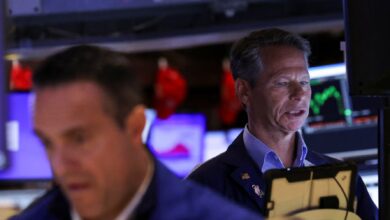 Stocks mixed, gold hits record as US government shuts down