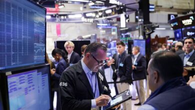 U.S. stocks pulled lower by financials; gold hits record highs