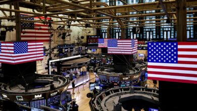 Stocks edge up on Amazon boost, dollar rises after Fed comments