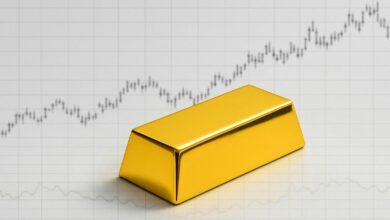 Gold Hovers Near US,000 As Market Momentum Cools