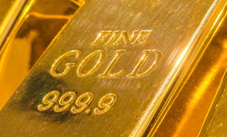 Gold prices ease on profit-taking after nearing ,000 mark