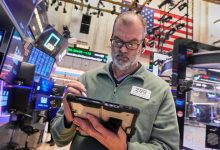 Microsoft yanks Wall Street lower as gold’s price swings sharply