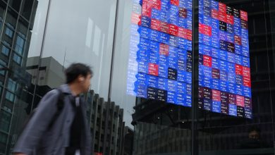 Asian stocks edge up as oil declines, dollar falls