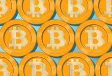 Bitcoin tops ,000, then pulls back