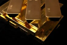 Gold falls as hawkish US Fed stokes 2026 interest-rate hike wagers