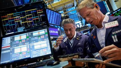Dow hits record high as oil slides; SpaceX soars Dow hits record high as oil slides; SpaceX soars