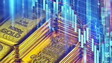 Gold rises from two-week low ahead of US inflation data
