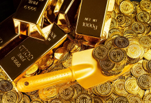 Gold futures rise above ,700 per ounce on COMEX