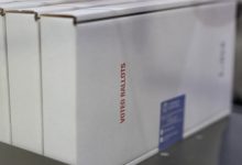 Federal judge extends block on Trump order seeking to limit mail voting in the midterms
