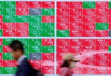 Global stocks fall as bond yields surge, oil rises sharply