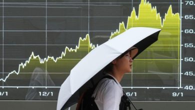 Stocks wobble after a surprisingly strong jobs report raises prospects of an interest rate hike | Stock Market
