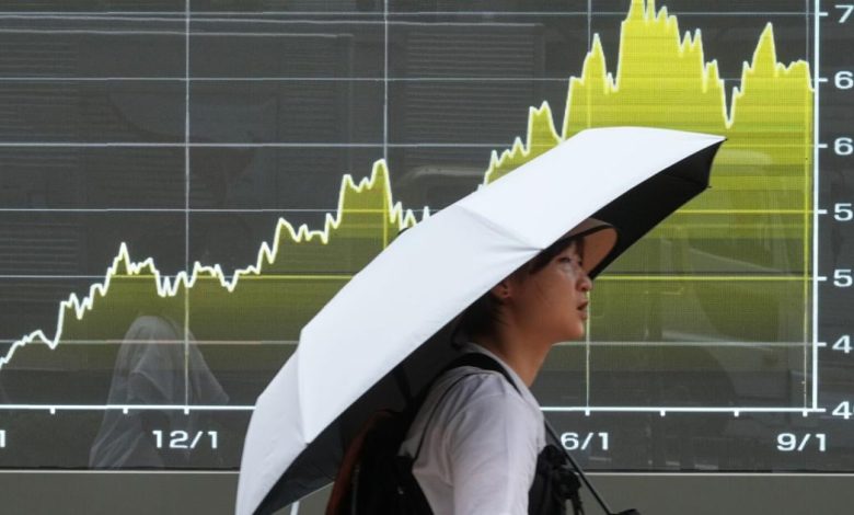 Stocks wobble after a surprisingly strong jobs report raises prospects of an interest rate hike | Stock Market