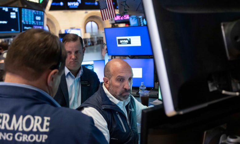 Stocks fall after a surprisingly strong jobs report raises prospects of an interest rate hike