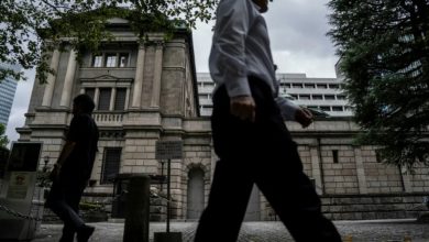 Global stocks mixed as yen falls despite Bank of Japan rate hike